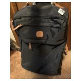 Brics suitcase with leather trim and wheels fits