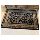 BLACK WINE AND GOLD CARPET WITH GOLD FRINGE