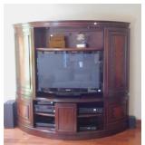 CURVED ENTERTAINMENT CENTER WITH FLAME BURL