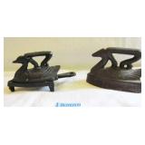 2 CAST IRON COLLAR IRONS AND 1 TRIVET