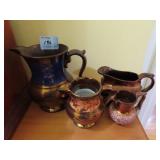 4 COPPER LUSTRE PITCHERS - 3" - 5.5"