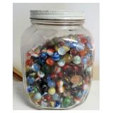 JAR OF GLASS MARBLES AND PENNIES