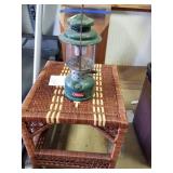 COLEMAN LANTERN AND WICKER STYLE TABLE