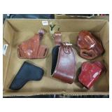 4 HOLSTERS AND A BELT EXTENSION