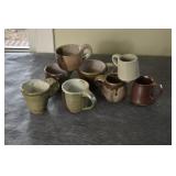 EIGHT POTTERY MUGS
