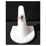 OVAL CUT GARNET AND WHITE TOPAZ ESTATE RING