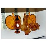 8 PIECES OF AMBER GLASS