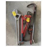 2 PRY BARS, PIPE WRENCH, AND CHISEL