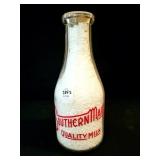 SOUTHERN MADE QUART GLASS MILK BOTTLE