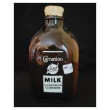 CARNATION MILK CO. AMBER GLASS GALLON MILK