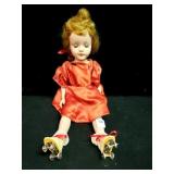 ANTIQUE MOLDED PLASTIC ROLLER SKATING DOLL