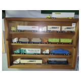 DISPLAY CASE W/9 TOY TRACTOR TRAILER TRUCKS