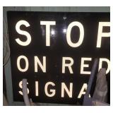 "STOP ON RED SIGNAL" SIGN, VACUUM CLEANER,