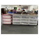 4 PLASTIC STORAGE BOXES ON ROLLERS