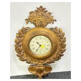 WOOD FRAME BATTERY OPERATED WALL CLOCK.
