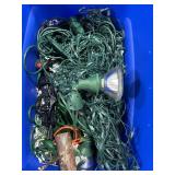 ASSORTED CHRISTMAS LIGHTS AND A TREE BAG.