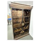 DISPLAY CABINET WITH WROUGHT IRON DOORS.
