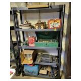 PLASTIC SHELF, GALVANIZED WATERING CAN, TAPE