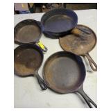 4 CAST IRON SKILLETS AND 1 CAST IRON GRIDDLE