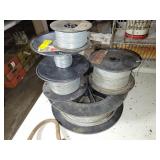 4 PARTIAL SPOOLS OF ELECTRIC FENCE WIRE