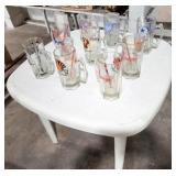 WHITE PLASTIC LAWN TABLE W/9 ADVERTISING