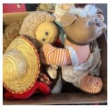 Box with assorted cabbage patch and porclin dolls