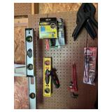 CONTENTS OF PEG BOARD - CLAMPS, LEVELS ETC.