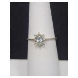 10KP WHITE GOLD AND LIGHT BLUE STONE RING