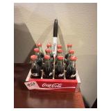 CASE OF SM DECORATIVE COKE BOTTLES IN CRATE