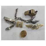 BAG OF ASSORTED PINBACKS AND BRASS WHISTLE