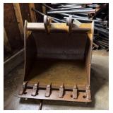 34ï¿½ tooth bucket  in the back of building will