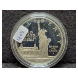 1986 ELLIS ISLAND SILVER DOLLAR