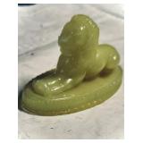 Jade sculpture titled 'Reclining Lionï¿½