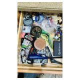 Three junk drawers in kitchen