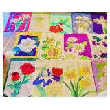 A collection of 13 vintage flower appliquï¿½ flags