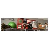 Contents of top shelf which is Christmas decor