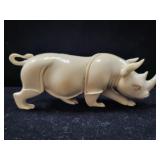 CARVED BONE OR IVORY RHINOCEROS FIGURINE -