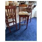 Three Oak barstools located upstairs