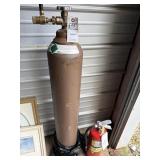 Helium tank and fire extinguisher located locker