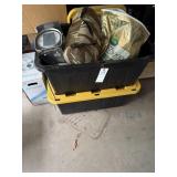 Two totes with household items, grass seed scale,
