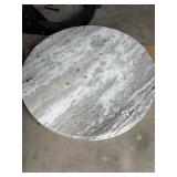 Three round pieces of granite located locker 60