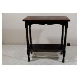 Vintage side table with book storage below