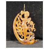 CARVED AMBER CUPID ON CRESCENT MOON PENDANT