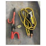 SET OF JUMPER CABLES & A STEERING WHEEL LOCK