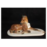 HAND PAINTED PORCELAIN LYING FOAL FIGURINE