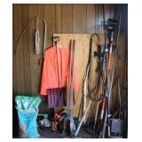 Wall of Long Handled Tools Raincoat & Pole Saw