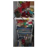METAL SHELF WITH YARD FLAGS AND BIRD FEEDERS