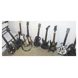 9 GUITAR HERO GUITARS AND 2 GUNS