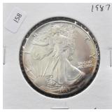 1987 SILVER EAGLE GEM NICE TONING