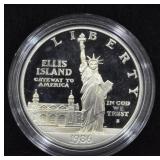 1986 ELLIS ISLAND SILVER DOLLAR
